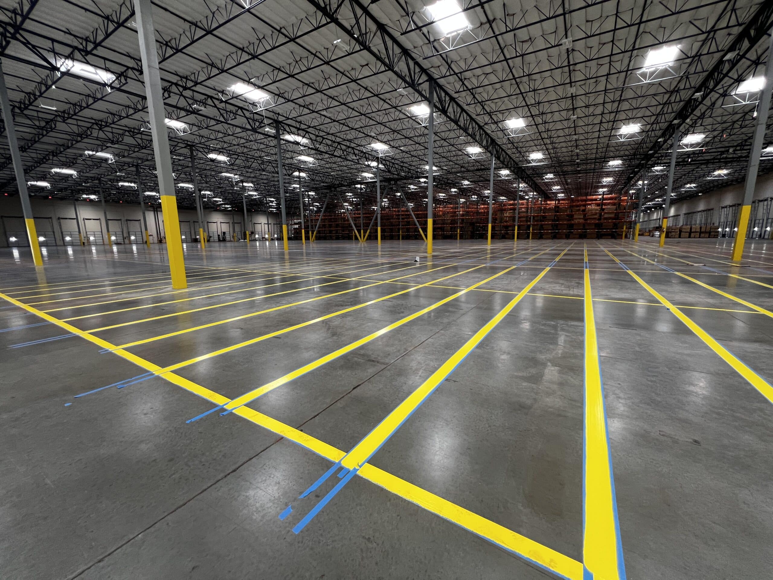 OSHA-compliant line striping services, warehouses, parking lots, and more!