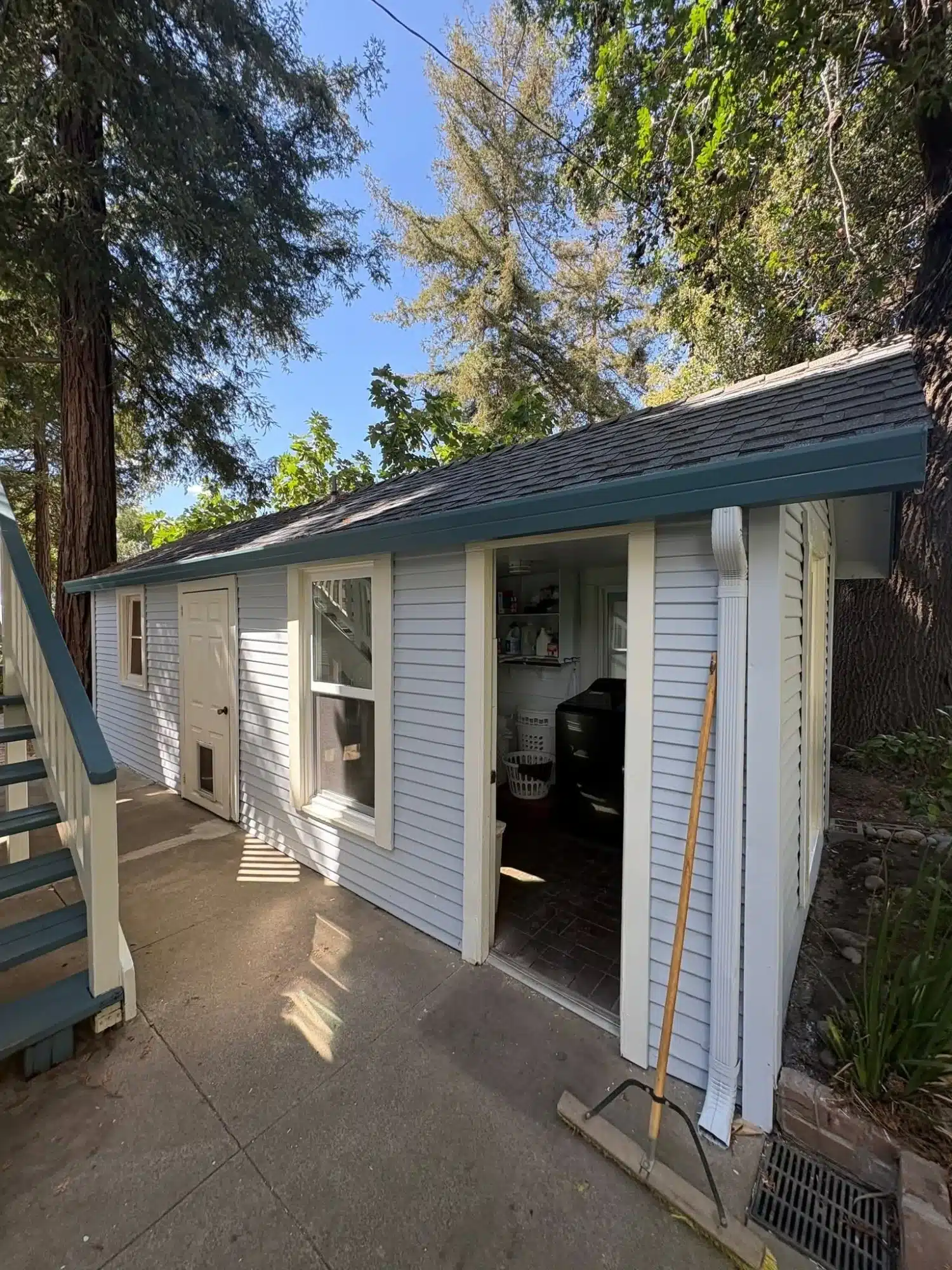 White Painted Residential Exterior White-painted residential home exterior with horizontal siding, cream trim, dark roof, and white doors and window frames